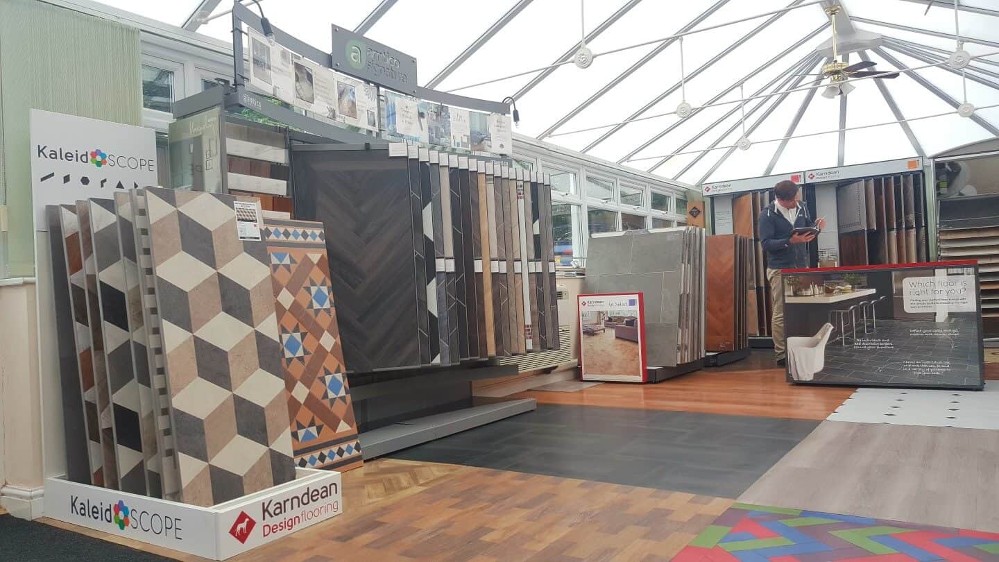 Inside the Cooper & Williams showroom, with wood, tile and vinyl displays under the glass roof